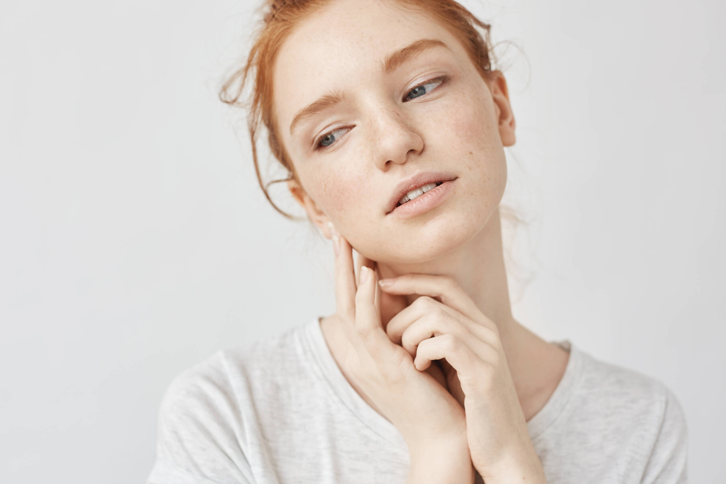 Close up portrait tender ginger woman dreaming smiling