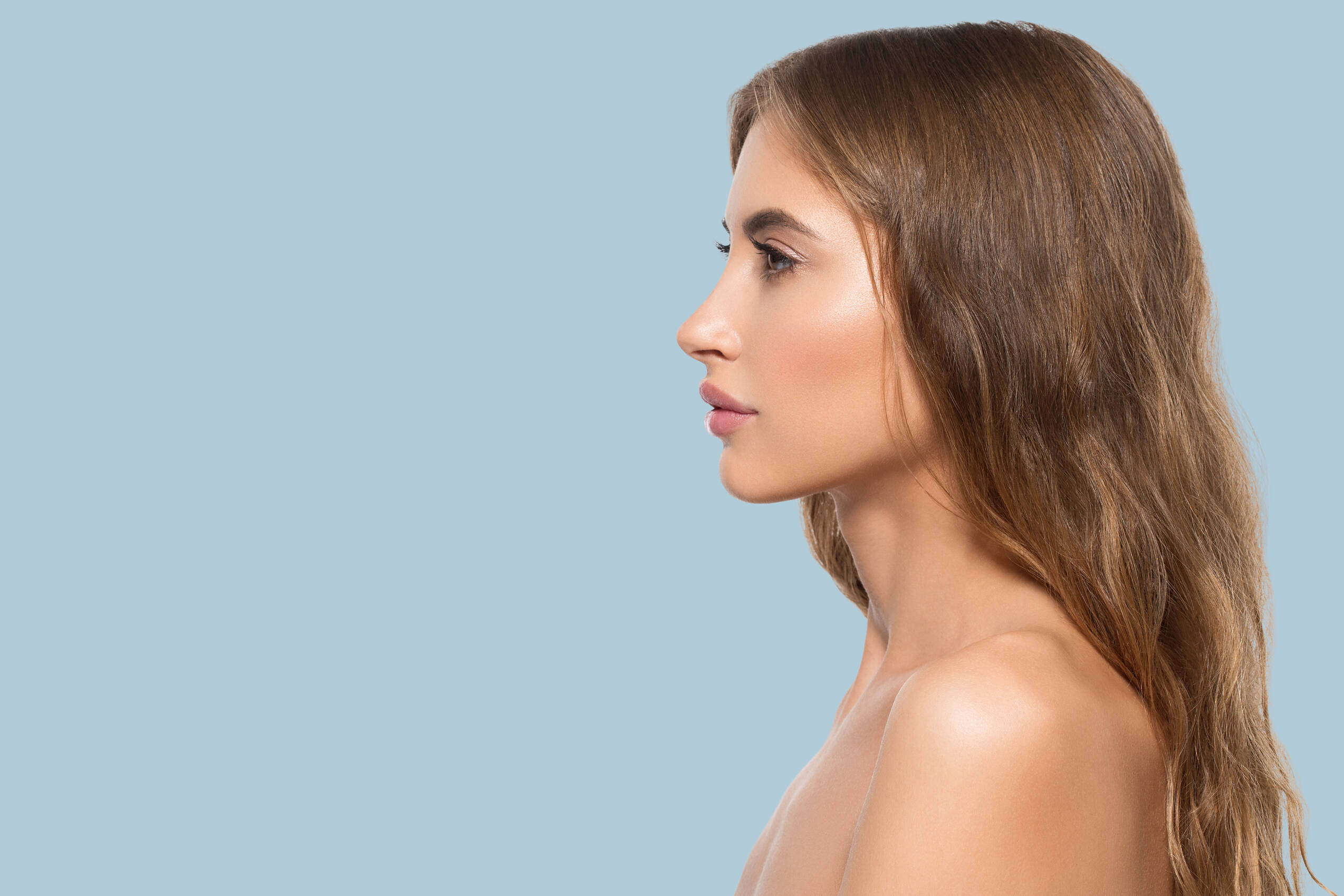 Beauty woman face profile portrait healthy beautiful skin female color background blue